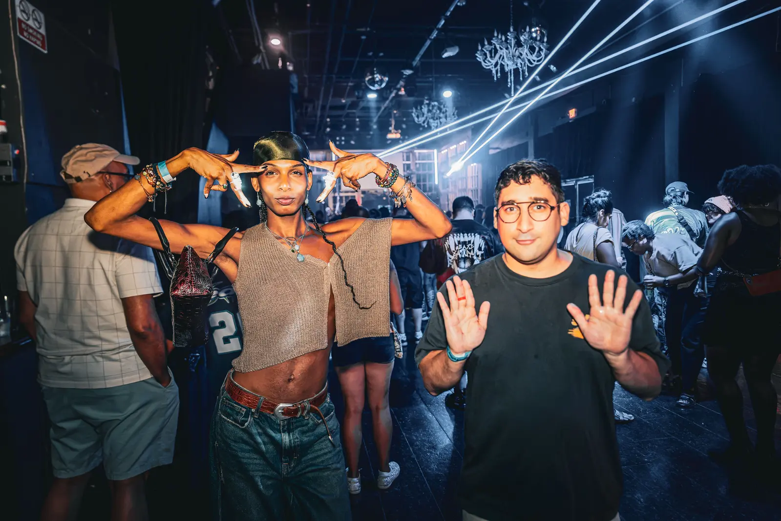 Guests beneath laser lights at the EDM LANC July 26 Show