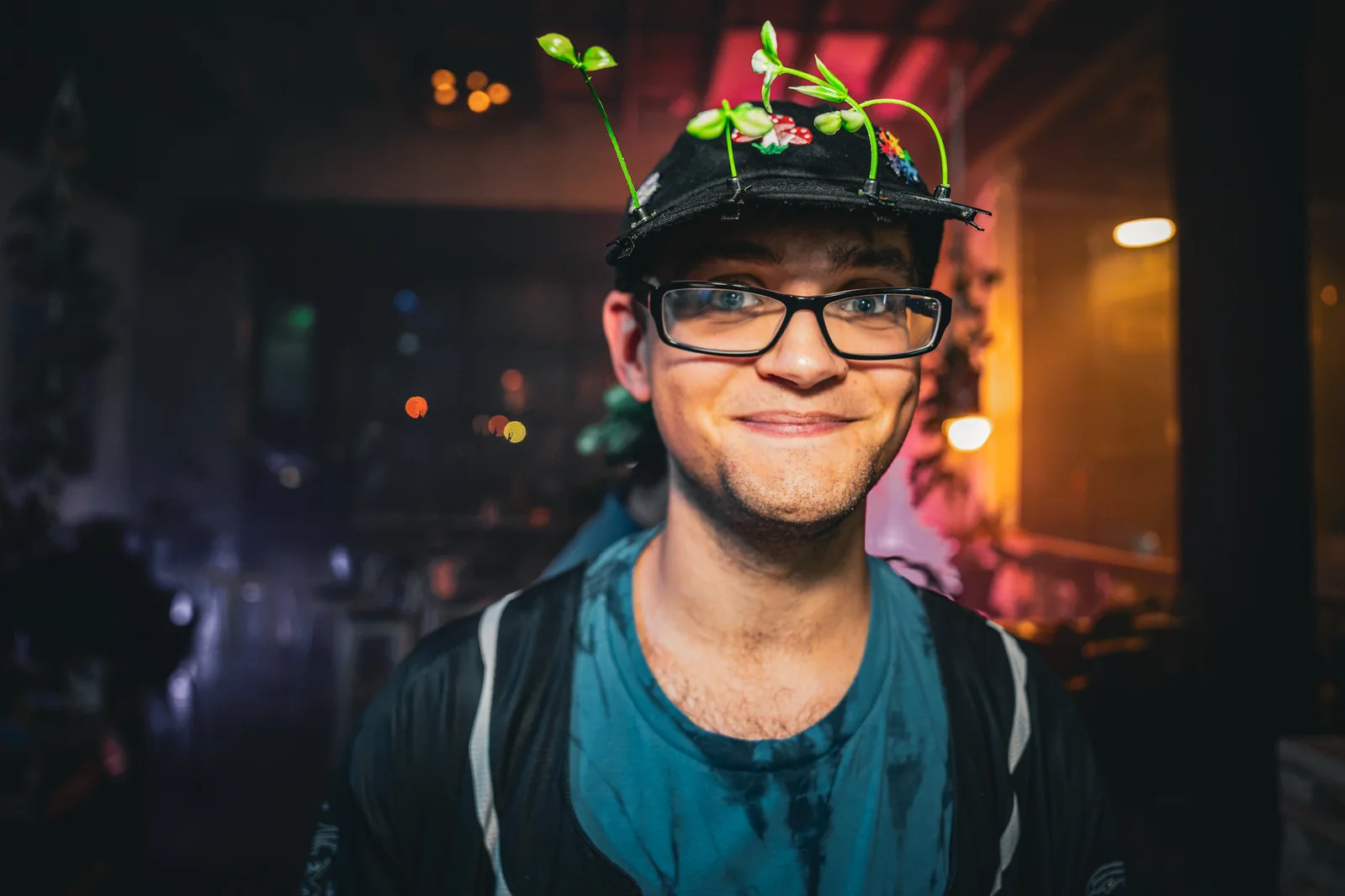 Guest wearing a plant-decorated hat at the EDM LANC September 25 Local Artist Feature Series